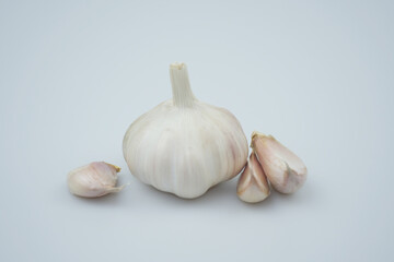 Garlic bulbs and cloves isolated on white background