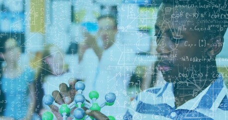 Teenage male student in striped shirt holding molecular model in science lab, with formula overlay