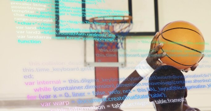 African American athlete in jersey shooting ball at hoop in gym, code overlay, copy space - Powered by Adobe