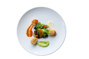 Gourmet seafood dish beautifully presented on a white plate