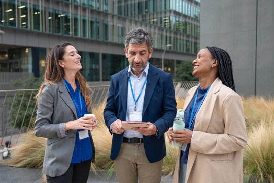Diverse business colleagues discussing in an outdoor break