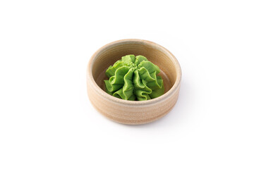 Wasabi in wooden bowl isolated on white background