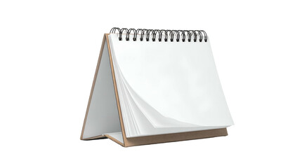 A blank desk calendar with a spiral binding, slightly opened on a black background