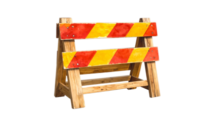 A wooden traffic barrier with red and yellow stripes, set against a black background