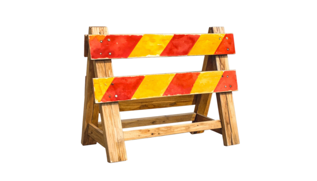 A wooden traffic barrier with red and yellow stripes, set against a black background