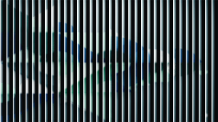 Abstract pattern of vertical metal blinds with blurred city reflections