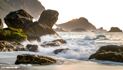 Rugged coast scene. Waves crash on mossy rocks, mountains in background. Long exposure effect