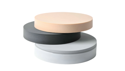 Three stacked, circular, pastel-colored platforms on a black background. Abstract design