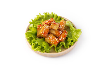 Chicken teriyaki pieces with sesame and lettuce isolated on white background