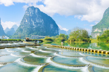 Beautiful rural landscape surrounded by Karst mountains in winter with at Yulin Dam (Yulinba) in Daxin County, Chongzuo city, Guangxi, China