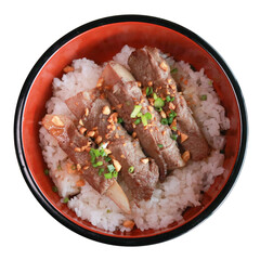 Delicious, freshly cooked ribs served with rice in a bowl, a culinary delight. The dish looks appetizing, garnished with what appears to be chopped peanuts