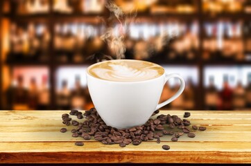 A white cup of hot steaming coffee drink