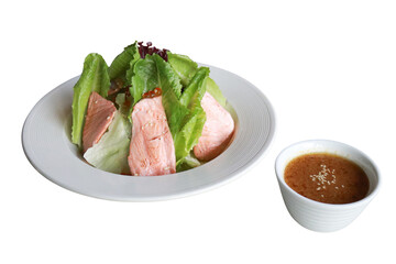 Delicious salad with fresh lettuce and tasty fish and sauce on the side