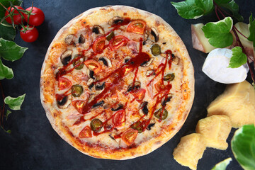 Pizza with hot peppers is Mexican. Jalapeno pepper. Mozzarella cheese and tomato sauce in pizza. Top view.