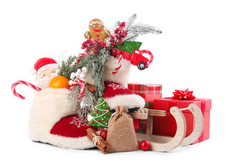 Saint Nicholas day. Sledge and boots with treats isolated on white
