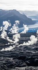 Geothermal steam vents rising from volcanic rock near a glacier in icelands highlands