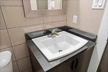 Bathroom sink with a mirror above it