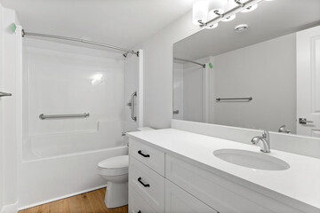 Bathroom with a white toilet, sink, and bathtub