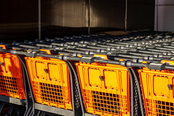 There are stacked shopping carts organized efficiently in the store