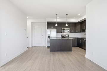 Kitchen with a large island and a stainless steel stove