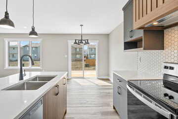 Kitchen with a white counter and a black stove