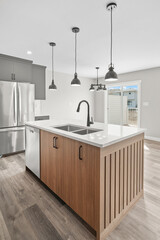 Kitchen with a wooden island and stainless steel appliances