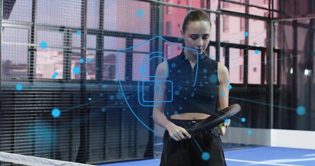 Female athlete adjusting stance; particles coalescing padlock shield showing technology security - Powered by Adobe
