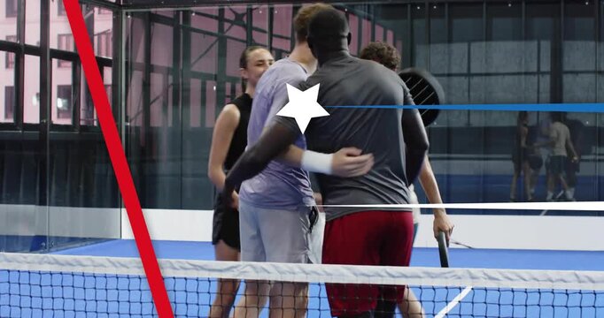 Padel players holding rackets stepping across net starting fist bumping and hugging before match