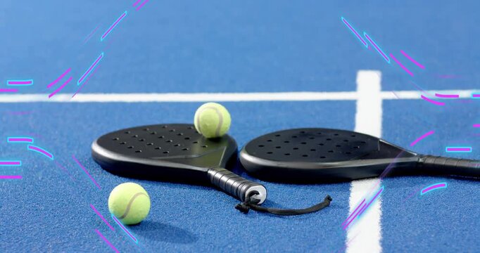 Second racket sliding from right causing ball dropping, bouncing off rackets and showing dynamics