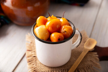 Tejocote en Dulce. Typical Mexican dessert made with Tejocote (Crataegus mexicana), a Mexican fruit in syrup, a fruit widely used in autumn, the Day of the Dead, posadas and the Christmas season.