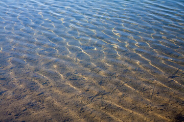 Sandy Lake Bottom under Crystal Clear Water