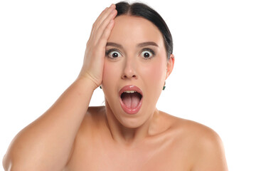 Studio shot of a surprised woman with dark hair and makeup, mouth open in shock, on a white background.