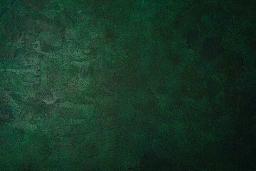 Olive green grunge wall with rough aged plaster texture