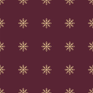 Seamless Christmas pattern. Grunge grainy snowflake texture. Festive endless vintage print. New Years vector. For textile, wallpaper, wrapping design. Golden snowflakes on burgundy background.