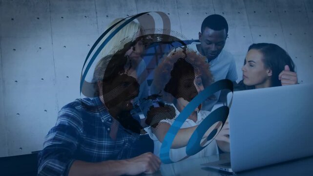 Rotating 3D globe logo animation fading and revealing coworkers reviewing business slides on laptop