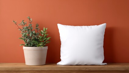Serene Still Life: A minimalist composition showcasing a soft, white pillow alongside a potted plant, resting on a wooden surface against a muted, earthy backdrop.