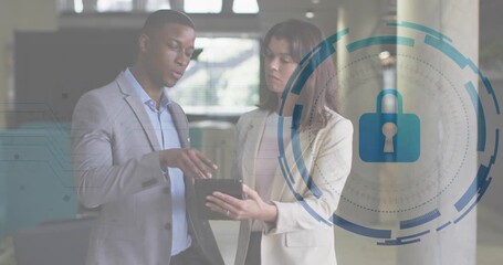 Man pointing tablet, woman consulting in business lobby causing lock icon, data rings for security - Powered by Adobe