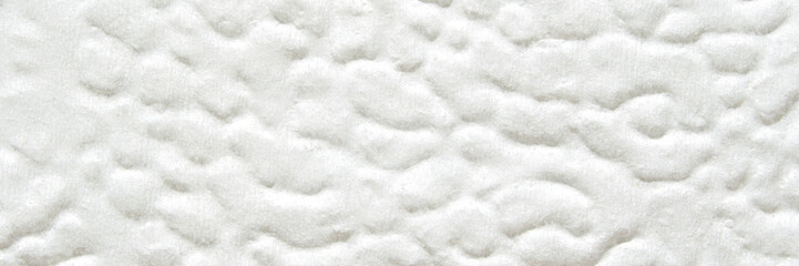 White textured surface with soft fluffy patterns in abstract design.