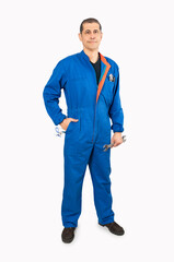 Full length portrait of a mature male worker in an overall uniform posing and smiling isolated on white background