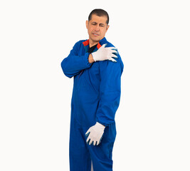 Hispanic mechanic man touching his shoulder wearing blue overalls on isolated white background