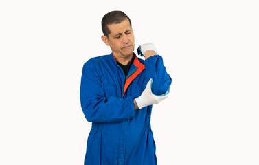 Close-up of a fit Hispanic man holding his elbow in pain while doing mechanic work isolated on white.