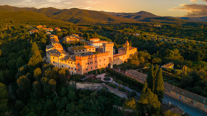 Italy scenery. Idyllic traditional towns of romantic Tuscany. Picturesque borgo Bolgheri medieval village . Panoramic drone view over sunset
