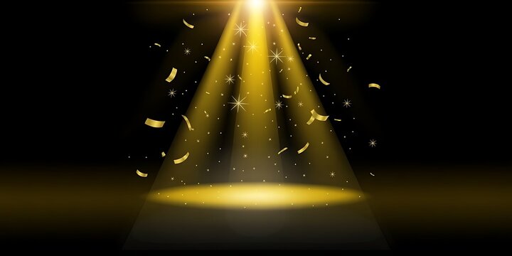 Golden confetti falling on stage with bright spotlight on black background