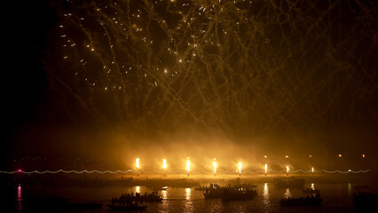 Warm Golden Lights and Boats Over Ganga River at Varanasi