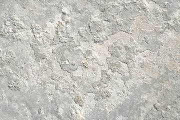 Concrete wall texture background. Uneven render stucco white painted concrete wall texture background. Rough and grunge wall in the sun.