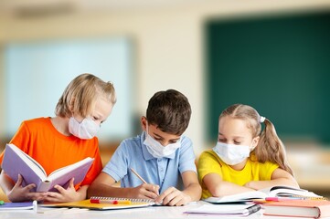 Fototapeta premium Smiling children students sitting in class room
