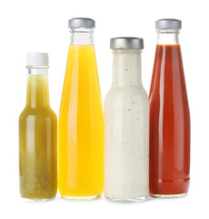 Bottles with different tasty sauces isolated on white