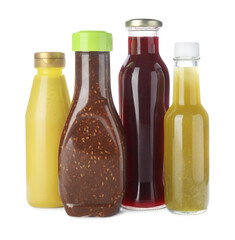 Bottles with different tasty sauces isolated on white