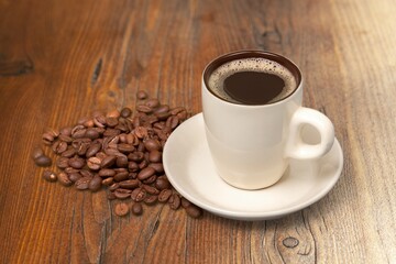A white cup of hot steaming coffee drink