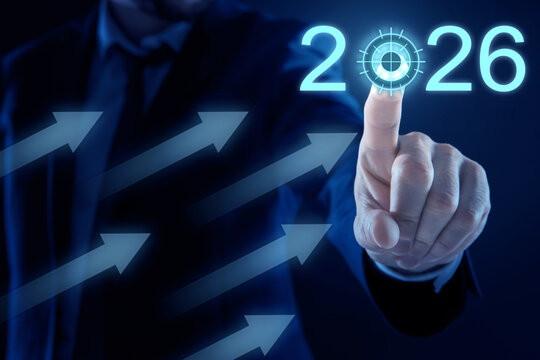 Businessman pointing at 2026 numbers on virtual screen with arrows against dark blue background, closeup. New year goals and plans